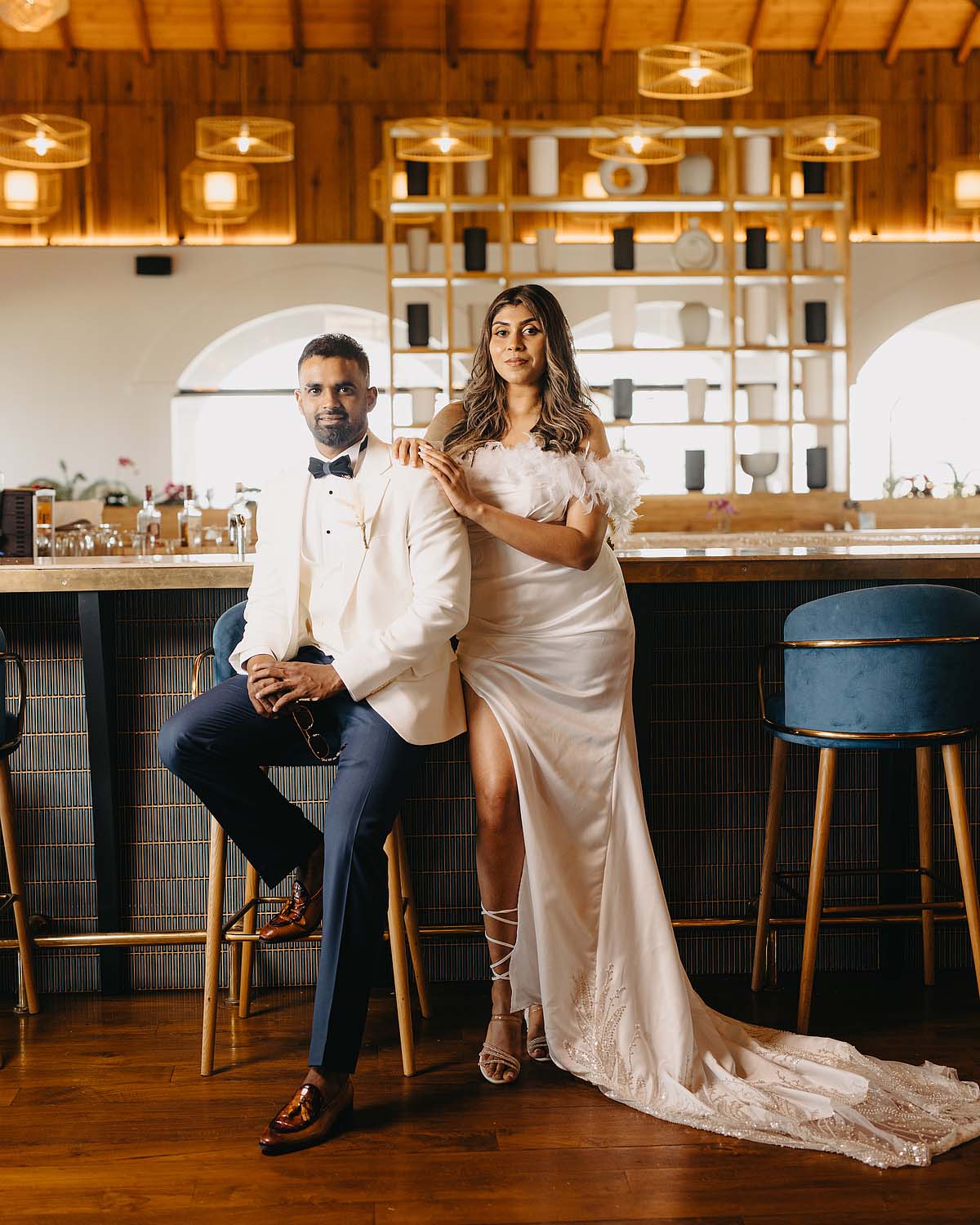 Chic and modern pre-wedding couple shoot in a luxury lounge bar setting.